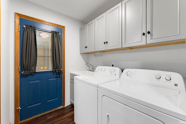 104 S Line St, South Whitley, IN 46787 - clothes washing area featuring washing machine and dryer, dark wood-style flooring, a sink, and cabinet space