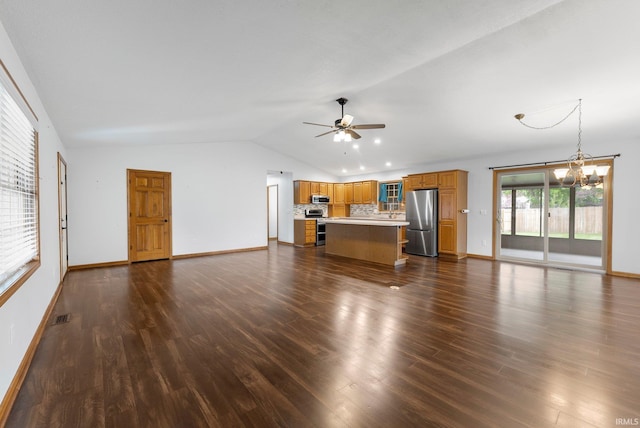 104 S Line St, South Whitley, IN 46787 - unfurnished living room with vaulted ceiling, ceiling fan with notable chandelier, visible vents, and dark wood-type flooring