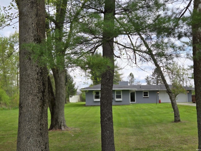 view of yard featuring an attached garage