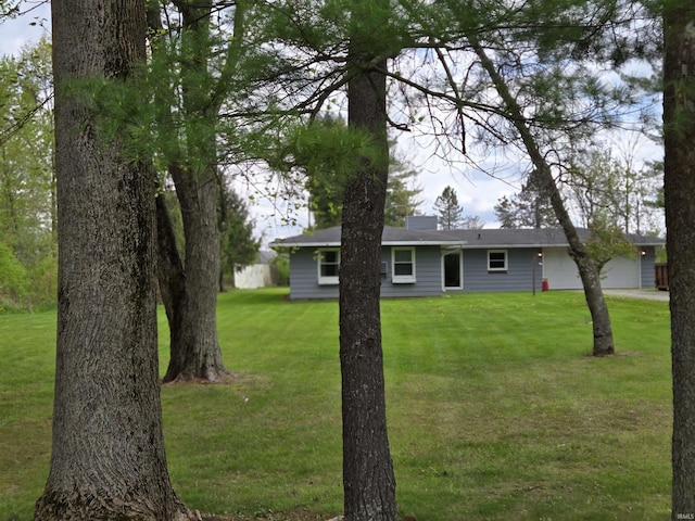 view of yard with a garage