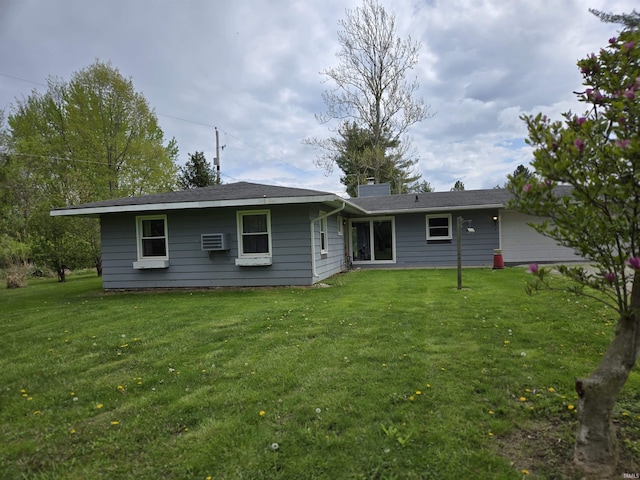 back of property featuring a yard and a chimney