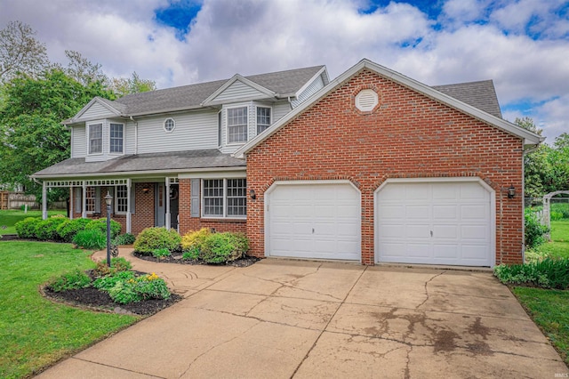 traditional-style house with a garage, a front lawn, brick siding, and driveway