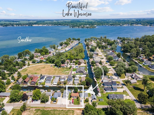 bird's eye view featuring a water view and a residential view