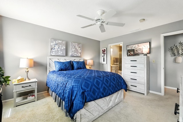 bedroom featuring connected bathroom, baseboards, ceiling fan, and carpet floors