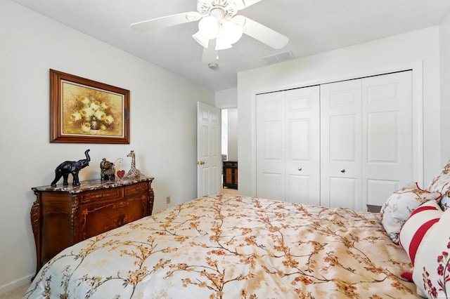 bedroom featuring a closet, visible vents, and a ceiling fan