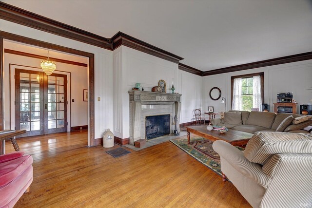 104 W Main St, Worthington, IN 47471 - living area featuring light wood-type flooring, a fireplace, and ornamental molding