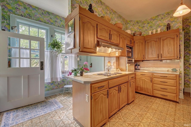 104 W Main St, Worthington, IN 47471 - kitchen with under cabinet range hood, wallpapered walls, light countertops, and white electric stovetop