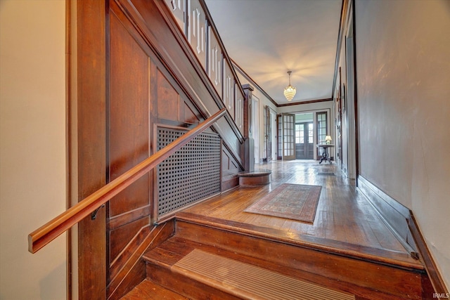 104 W Main St, Worthington, IN 47471 - stairway with an inviting chandelier, baseboards, and hardwood / wood-style floors