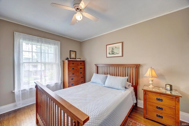 104 W Main St, Worthington, IN 47471 - bedroom with crown molding, baseboards, ceiling fan, and wood finished floors