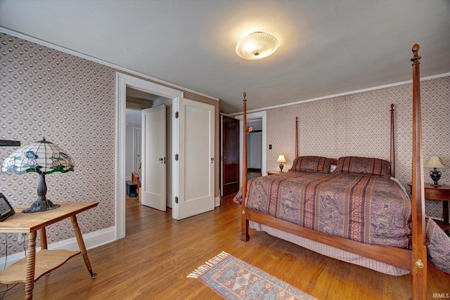 104 W Main St, Worthington, IN 47471 - bedroom with ornamental molding, light wood finished floors, and wallpapered walls