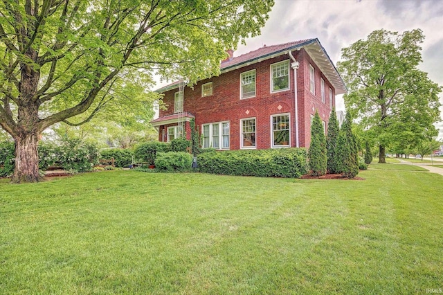 104 W Main St, Worthington, IN 47471 - view of front facade featuring a front lawn and brick siding