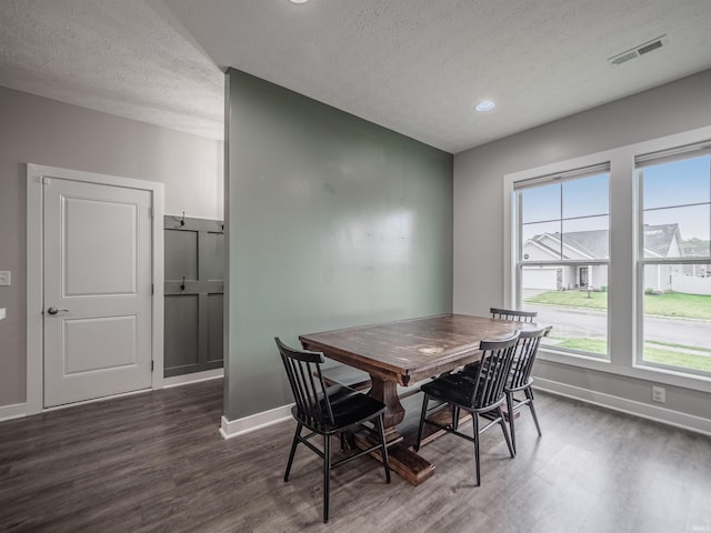 dining room with recessed lighting, a textured ceiling, baseboards, visible vents, and dark wood-style floors