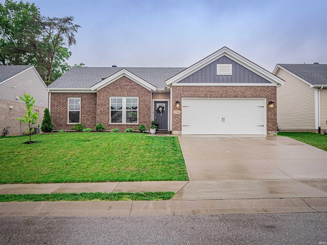 view of front facade featuring concrete driveway, a front yard, brick siding, and an attached garage