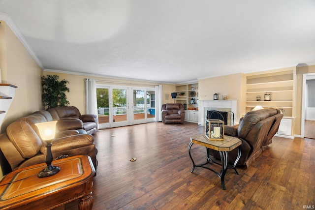 5259 E Willow Ct, Monticello, IN 47960 - living area featuring french doors, dark wood-style flooring, ornamental molding, built in features, and a brick fireplace