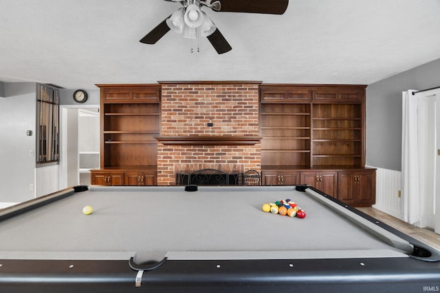 5259 E Willow Ct, Monticello, IN 47960 - recreation room featuring a fireplace, ceiling fan, and pool table