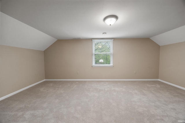 5259 E Willow Ct, Monticello, IN 47960 - bonus room with light colored carpet, vaulted ceiling, baseboards, and visible vents