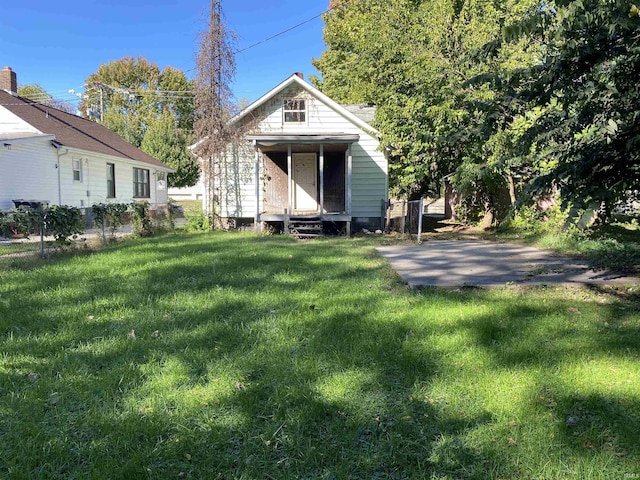 1514 Van Buren St, South Bend, IN 46628 - exterior space featuring a front lawn, an outbuilding, fence, and entry steps