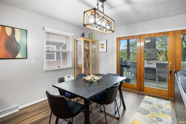 dining room featuring plenty of natural light, visible vents, and wood finished floors
