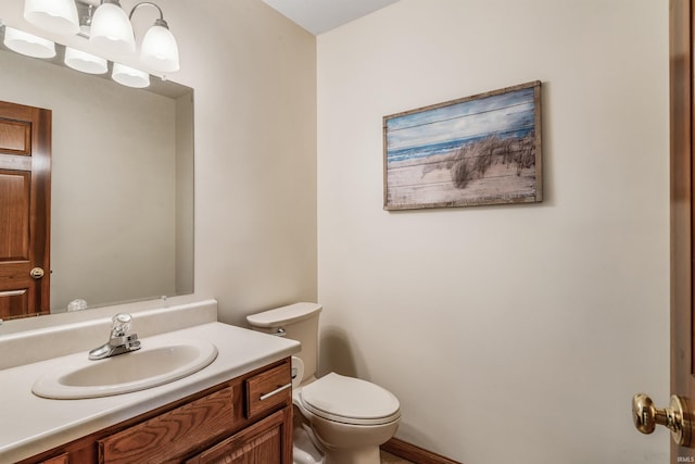 bathroom with toilet and vanity