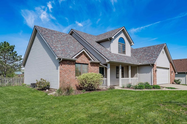 traditional-style home featuring a porch, roof with shingles, a garage, and brick siding