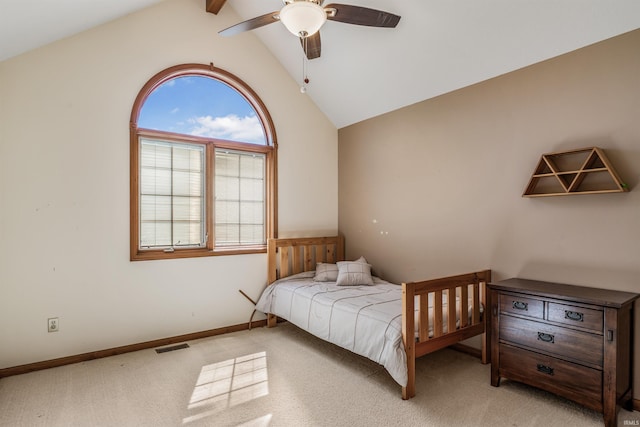 bedroom with light colored carpet, ceiling fan, visible vents, and vaulted ceiling with beams