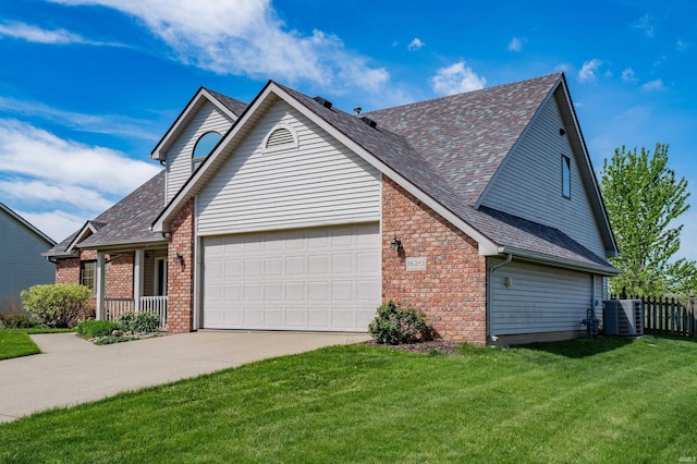 traditional-style house featuring concrete driveway, brick siding, roof with shingles, and a garage