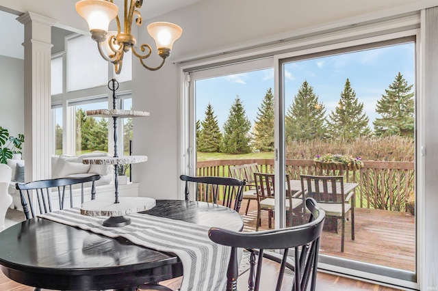 dining room with a chandelier and wood finished floors