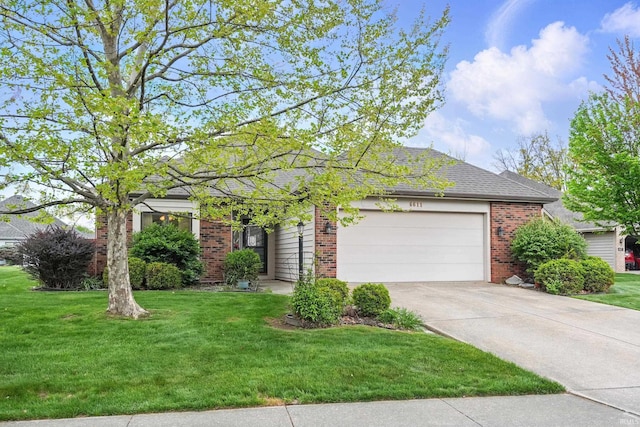 view of front of house with a garage, a front lawn, brick siding, and driveway