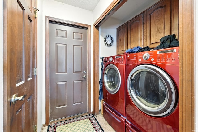 laundry area with cabinet space and independent washer and dryer