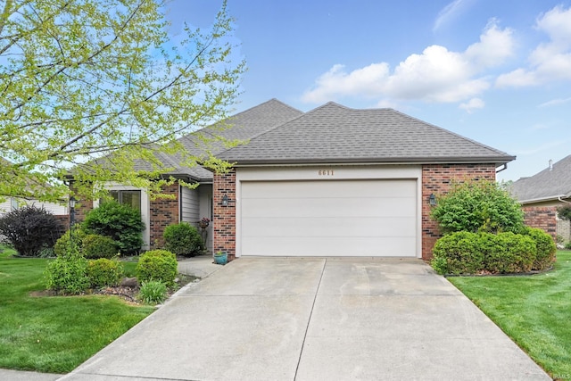 ranch-style home with a front lawn, driveway, brick siding, and an attached garage