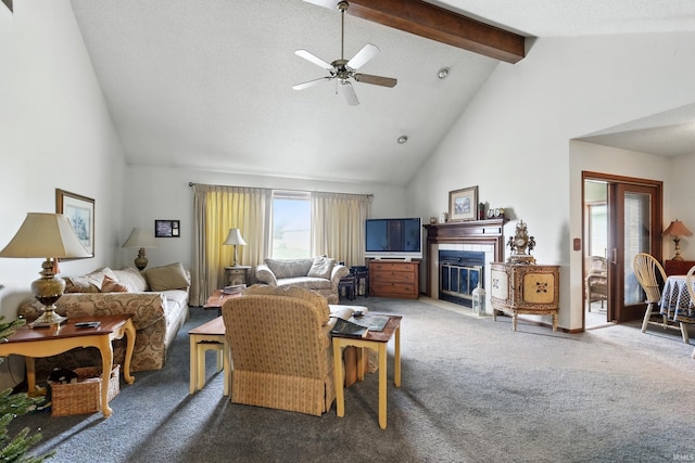 living room featuring carpet, high vaulted ceiling, beam ceiling, a tiled fireplace, and ceiling fan