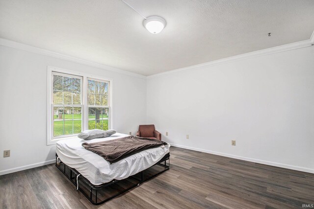 21521 Cheri Ln, Bristol, IN 46507 - bedroom featuring ornamental molding, baseboards, and wood finished floors