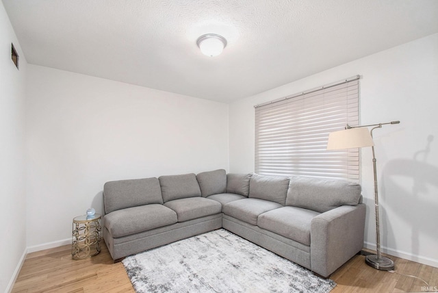 21521 Cheri Ln, Bristol, IN 46507 - living area with visible vents, wood finished floors, and baseboards
