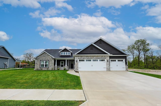 craftsman inspired home with driveway, a garage, stone siding, and a front yard