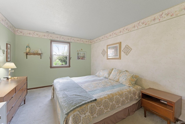 carpeted bedroom featuring baseboards
