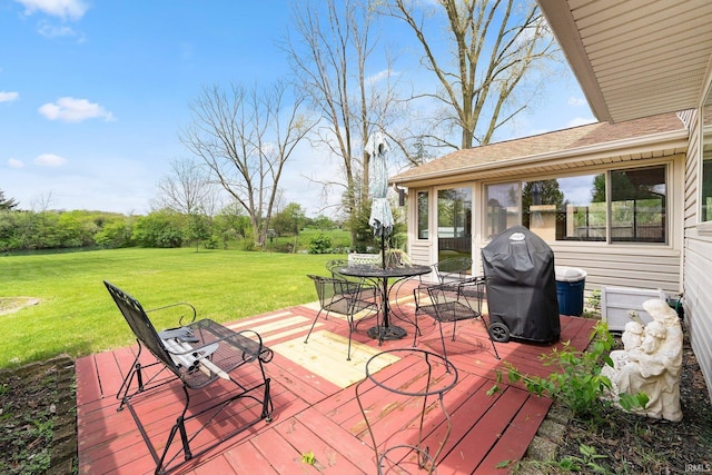 deck with a yard, area for grilling, and outdoor dining area