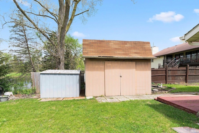 view of shed with fence