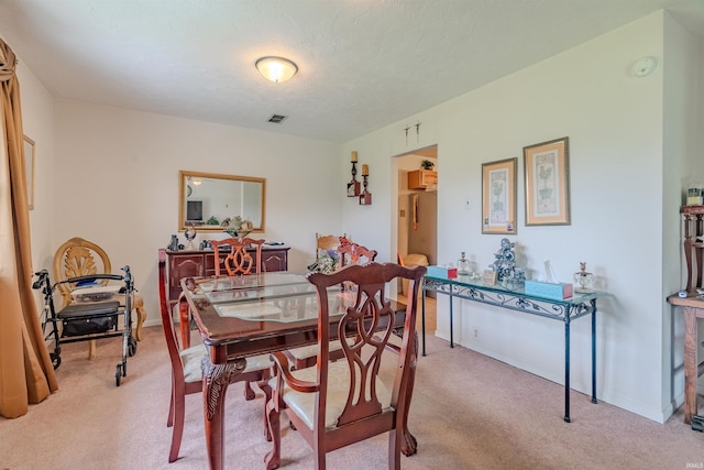 1112 W Walnut St, Summitville, IN 46070 - dining area with light carpet and visible vents