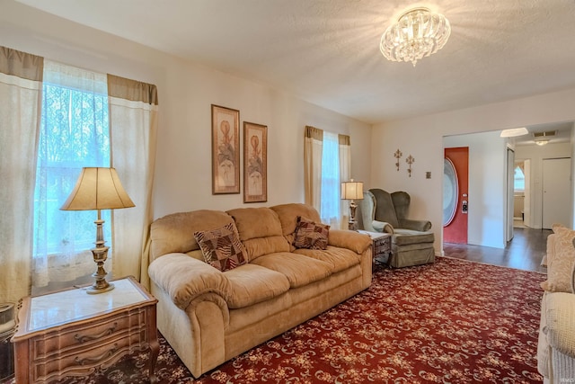 1112 W Walnut St, Summitville, IN 46070 - living room featuring wood finished floors and a notable chandelier
