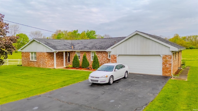 1112 W Walnut St, Summitville, IN 46070 - ranch-style house with brick siding, a front lawn, and aphalt driveway