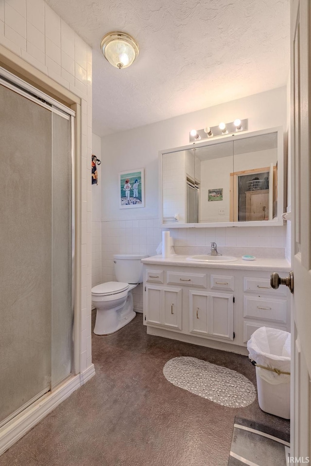 1112 W Walnut St, Summitville, IN 46070 - full bathroom with a stall shower, tile walls, vanity, and toilet