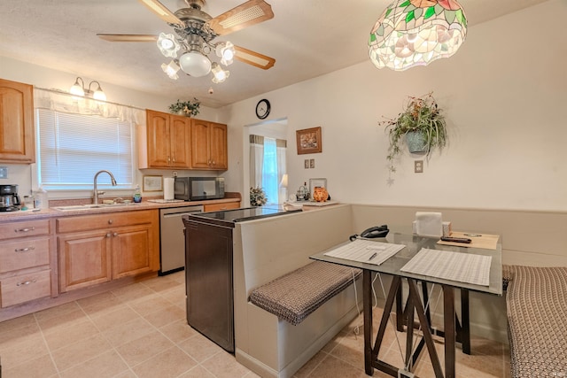 1112 W Walnut St, Summitville, IN 46070 - kitchen featuring a sink, light tile patterned flooring, black microwave, and a ceiling fan