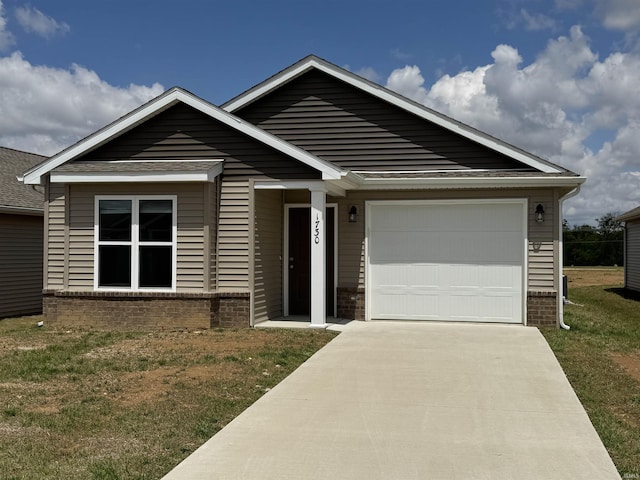 ranch-style home featuring concrete driveway, a front lawn, brick siding, and an attached garage