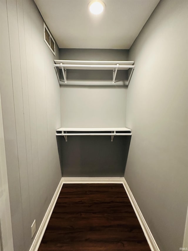 spacious closet featuring visible vents and wood finished floors