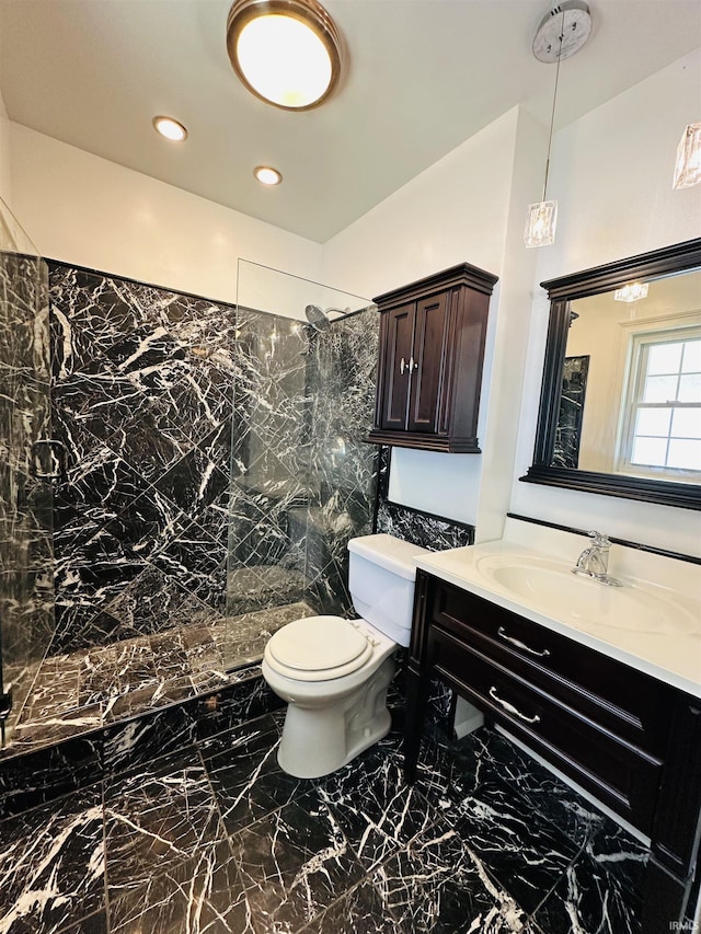 bathroom featuring toilet, marble finish floor, vanity, recessed lighting, and a walk in shower