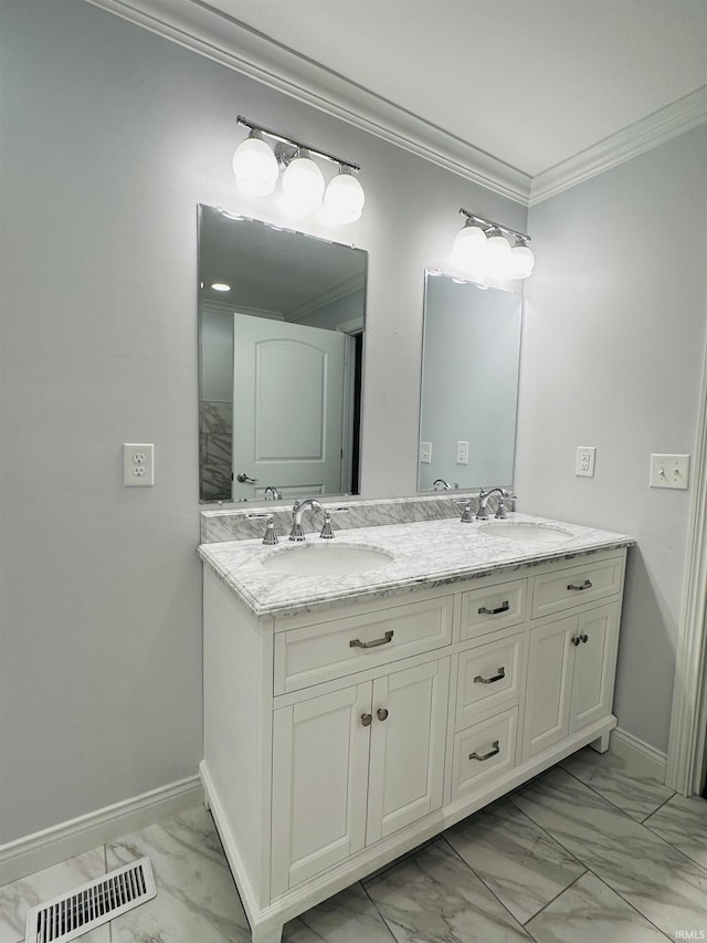 bathroom with visible vents, marble finish floor, baseboards, and a sink