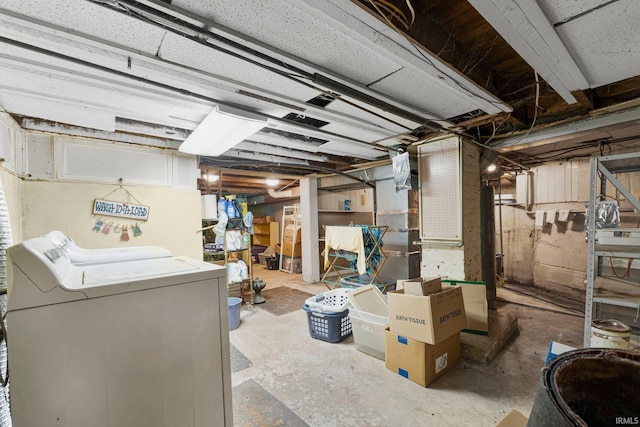 unfinished below grade area with washer / clothes dryer