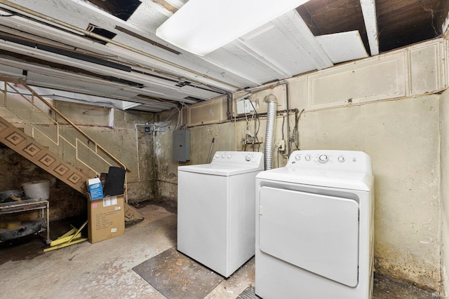 washroom featuring separate washer and dryer, laundry area, and electric panel
