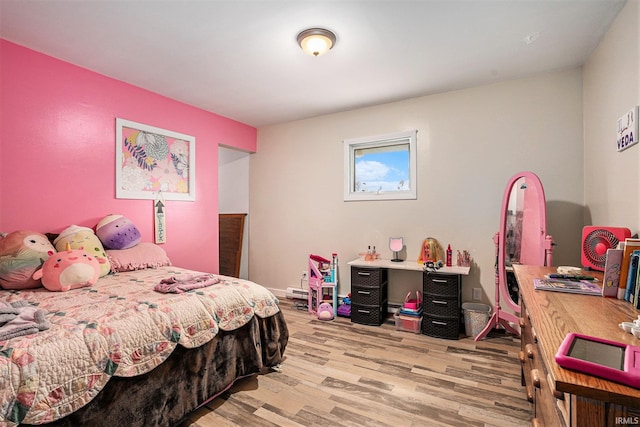 bedroom featuring light wood-style flooring