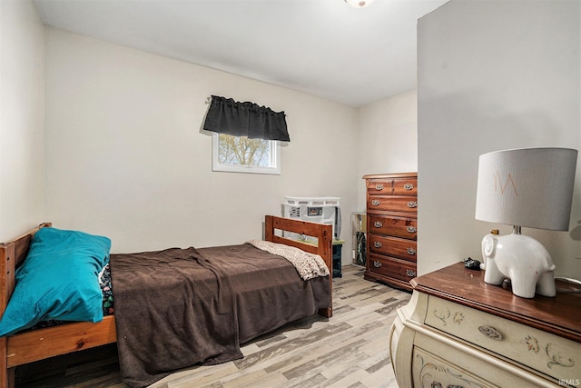 bedroom with light wood-style floors